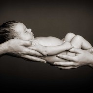 New baby in parents' hands by Eric Pearce Photography