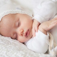 Baby Photographer East Grinstead | Baby sleeping on a bed