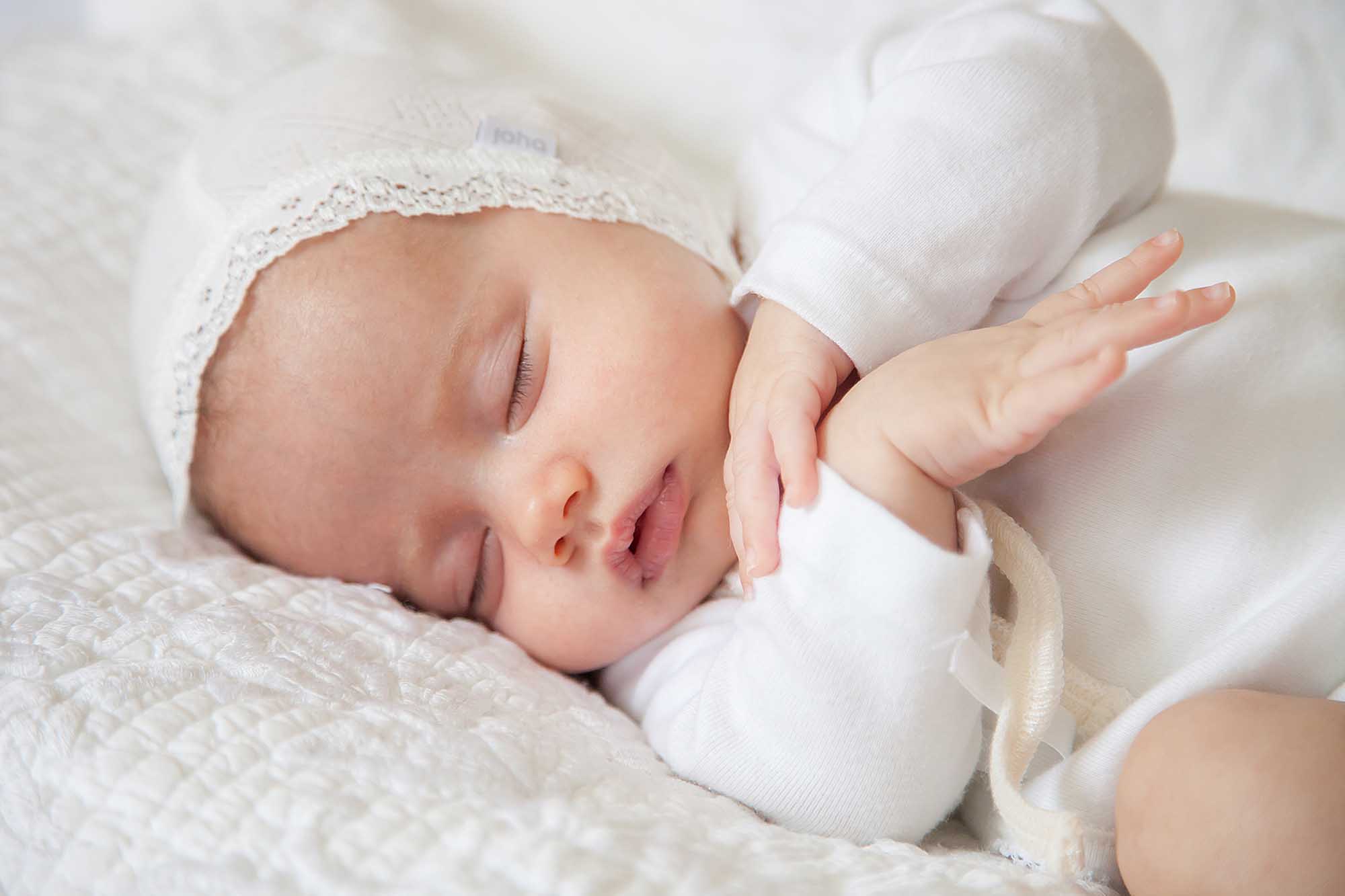 Baby Photographer East Grinstead | Baby sleeping on a bed